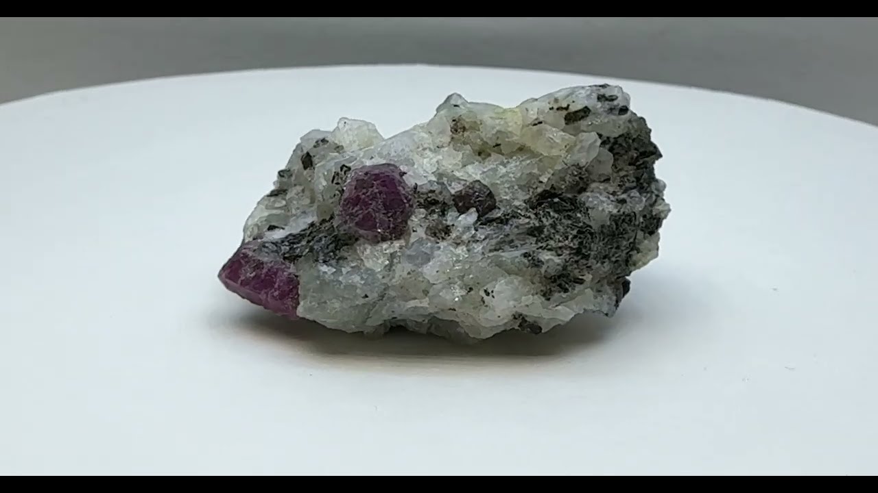 Red Corundum (Ruby) in Garnet&ndash;Biotite Gneiss &mdash; Fluorescent Specimen     1