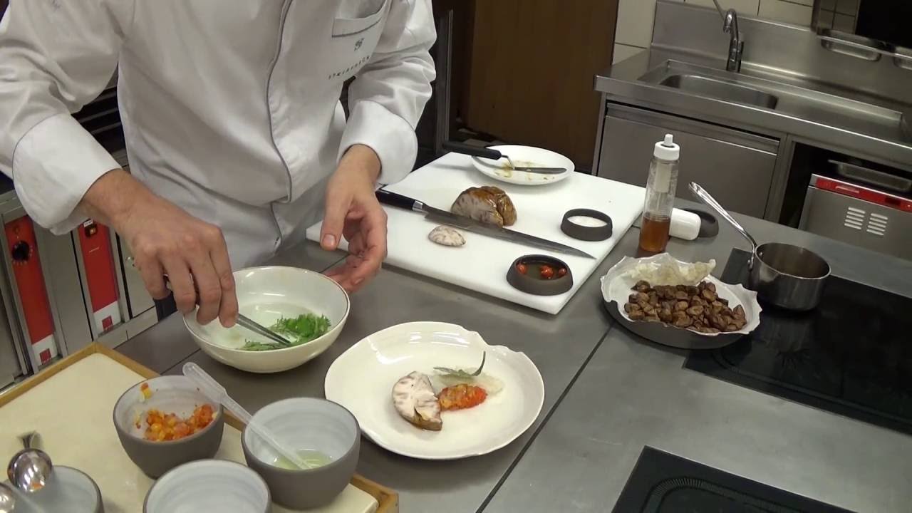 Reitbauer prepares a brain dish at the Michelin star Steirereck in Vienna