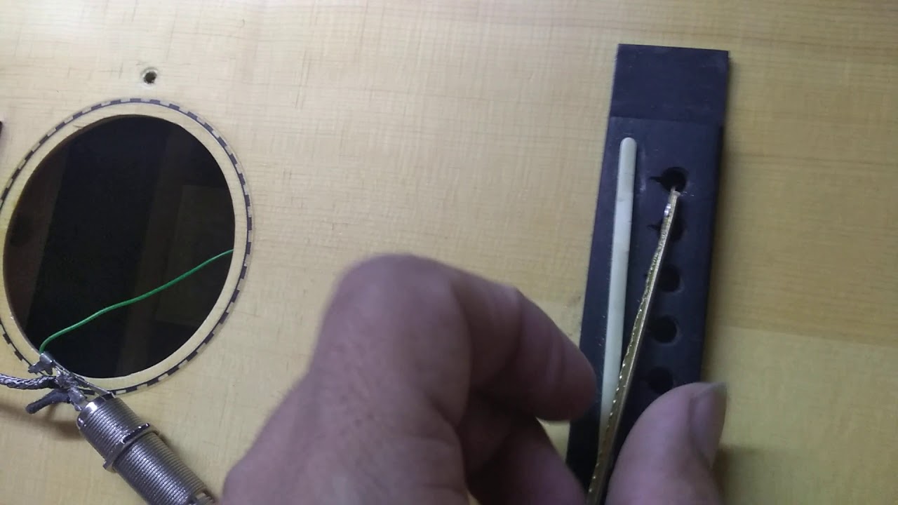Solución de masa en guitarra acústica