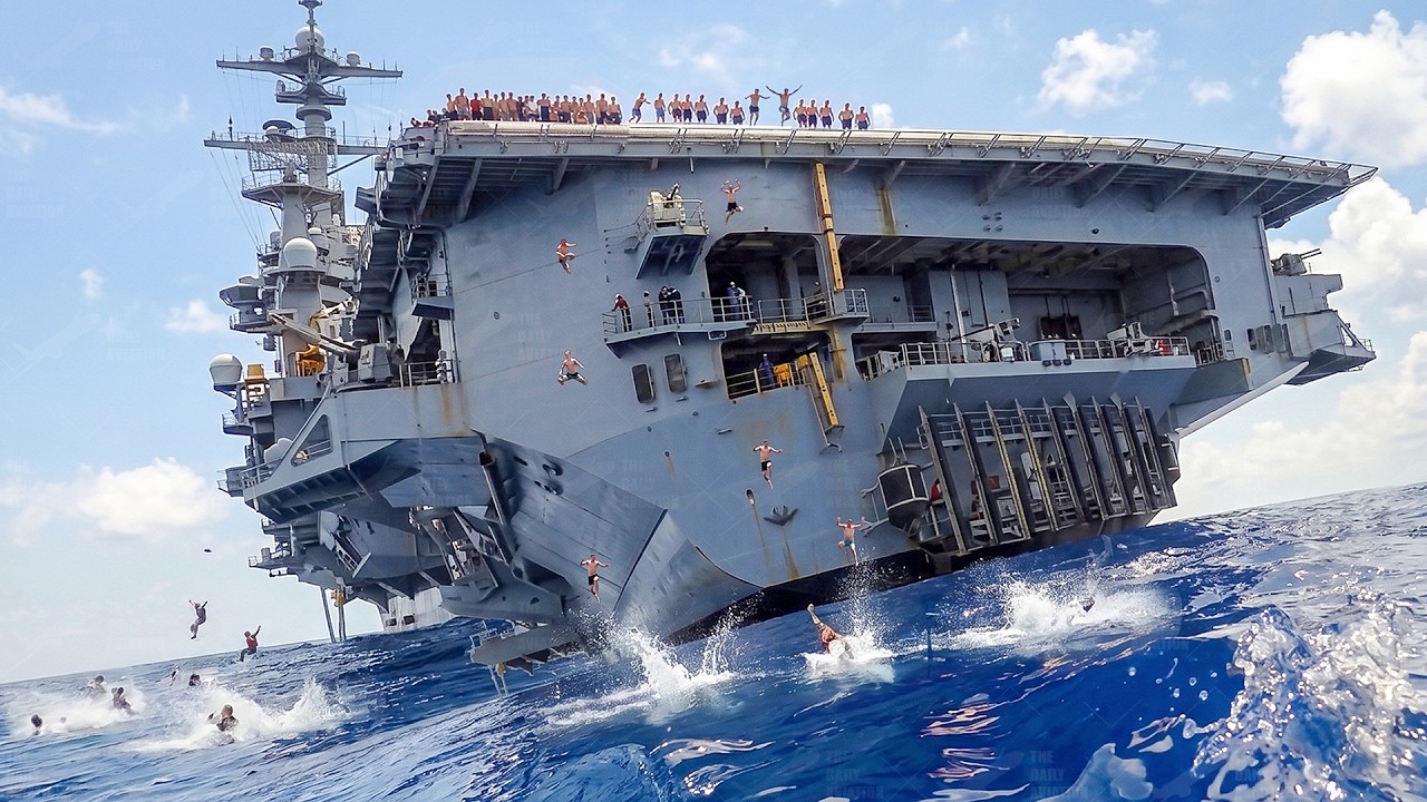 US Sailors Perform Crazy Jumps From a $13 Billion Aircraft Carrier in the Middle of the Ocean