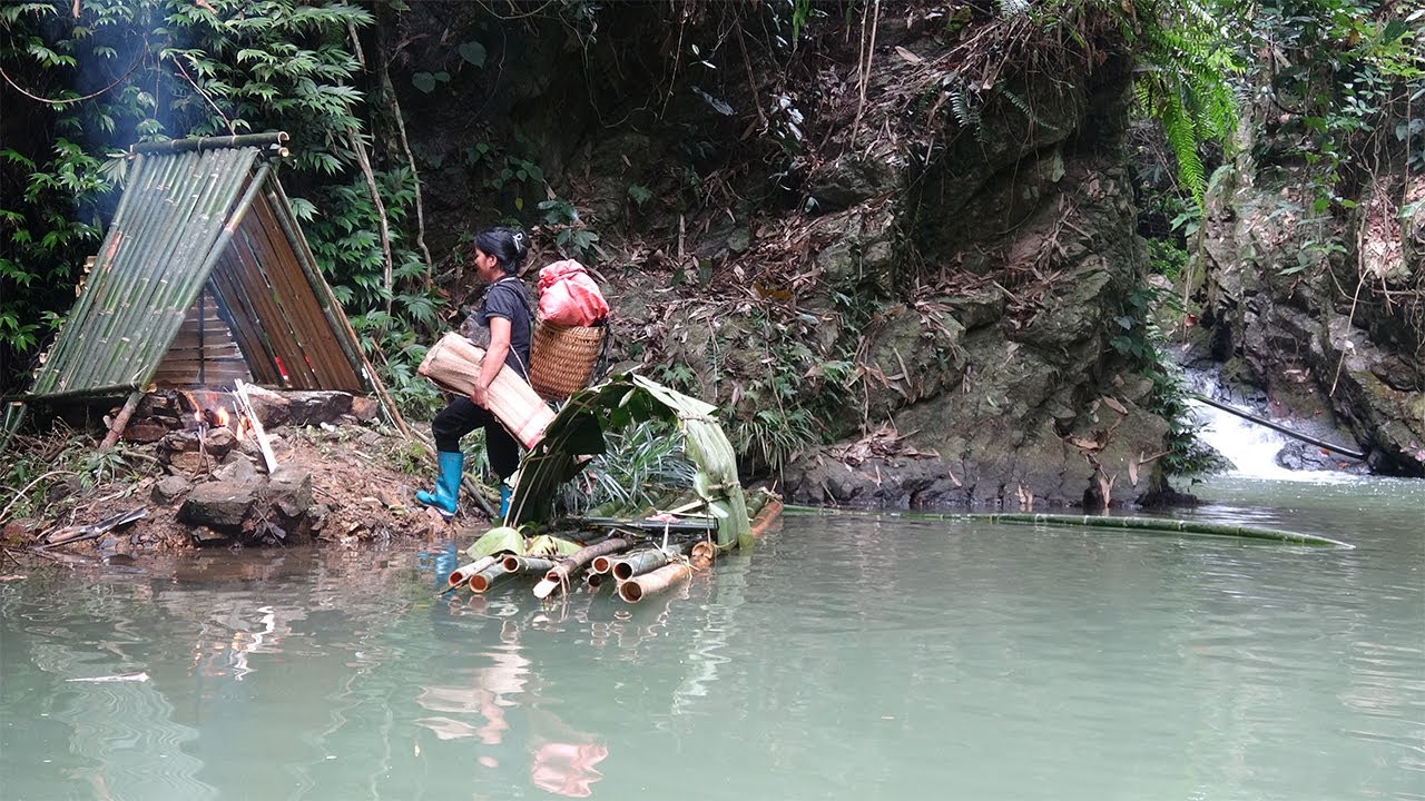 Orphan girl tries to survive in makeshift shelter next to a lake in the rainforest