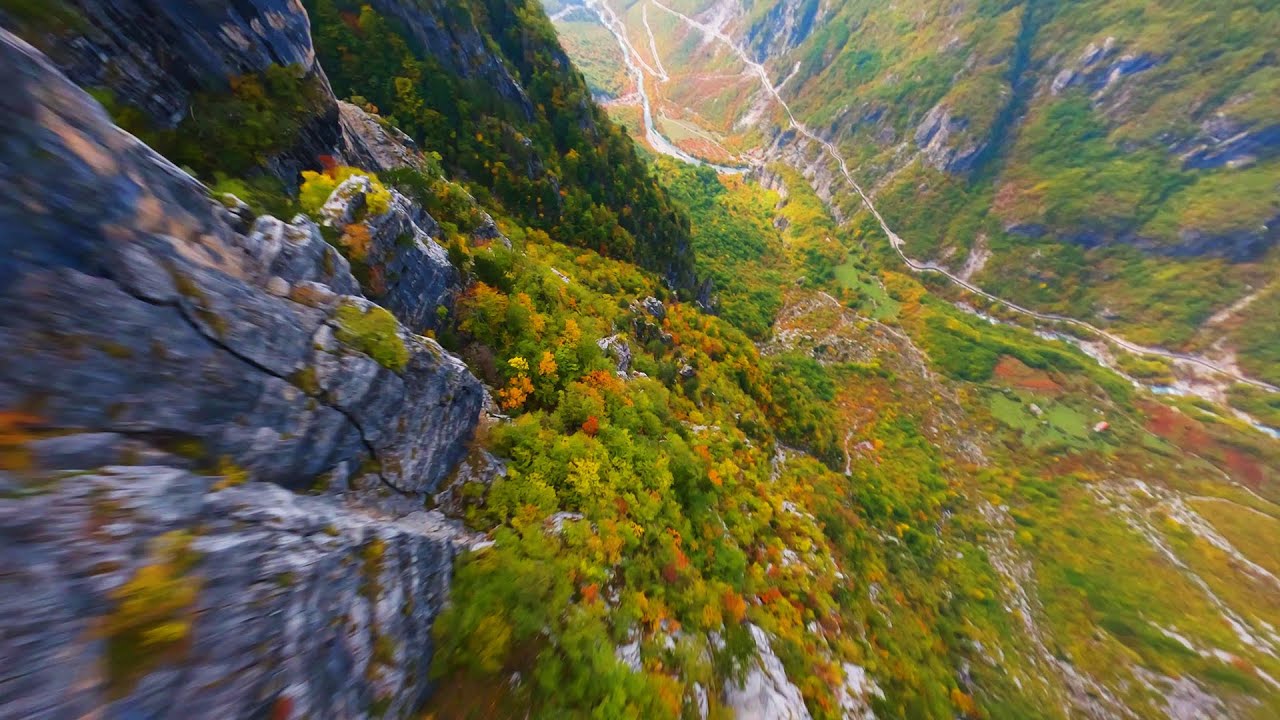 FPV drone flight over the mountains surrounding Theth, Albania in Autumn