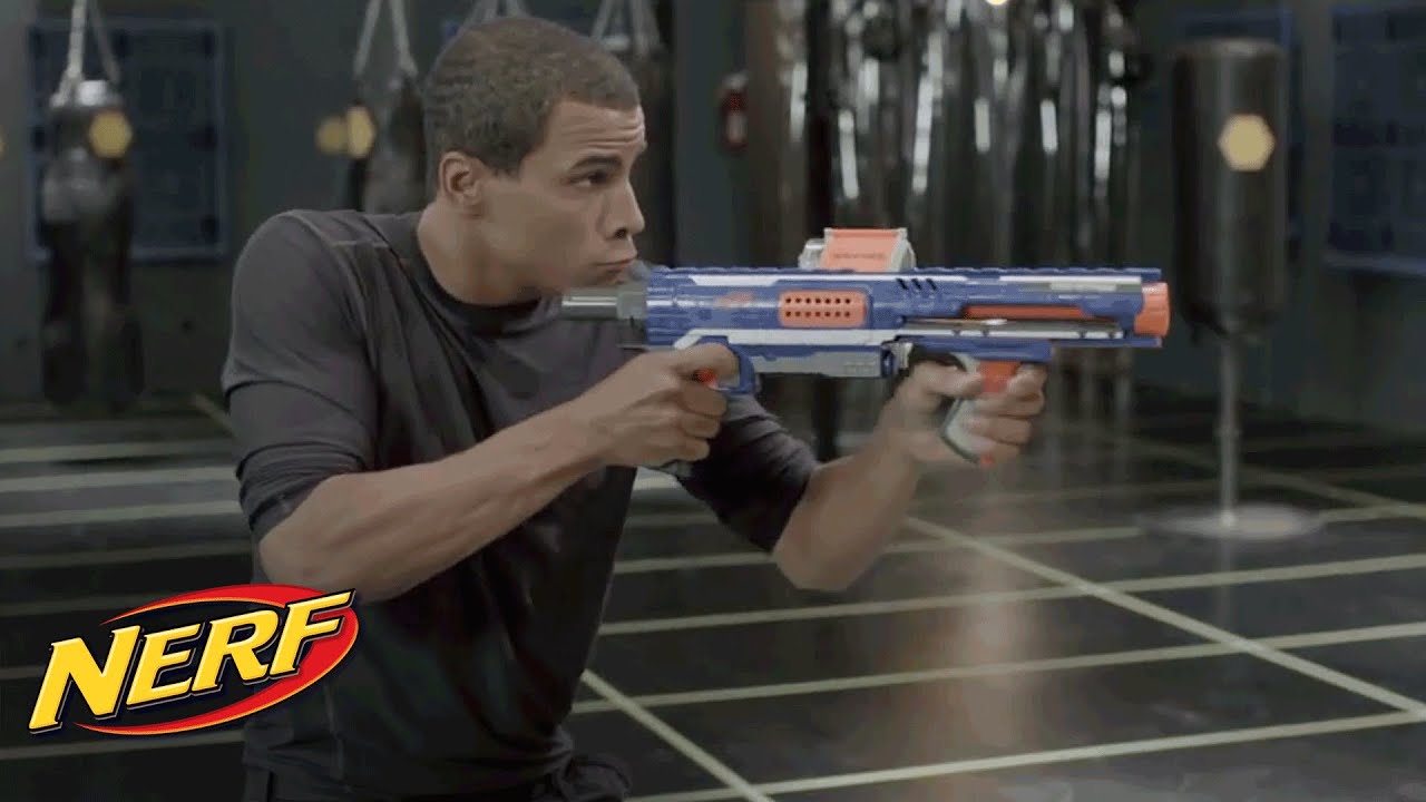 NERF - John Brenkus From Sport Science Shows Off The Rampage & Retaliator Blasters