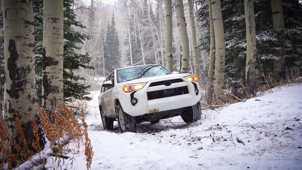 WINTER CAR CAMPING DURING A SNOW STORM