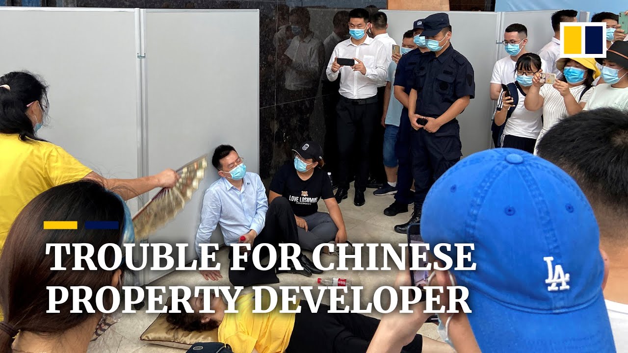 Angry protest at headquarters of China Evergrande as property giant faces liquidity crunch