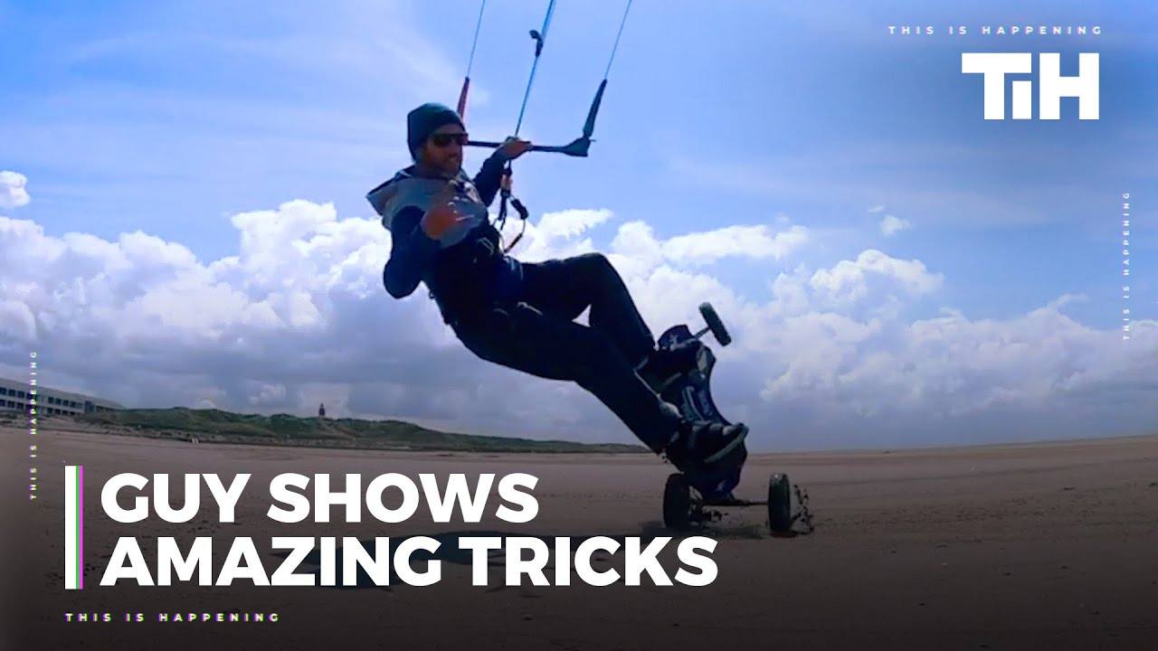 Guy Shows Amazing Tricks While Kite Landboarding At Beach