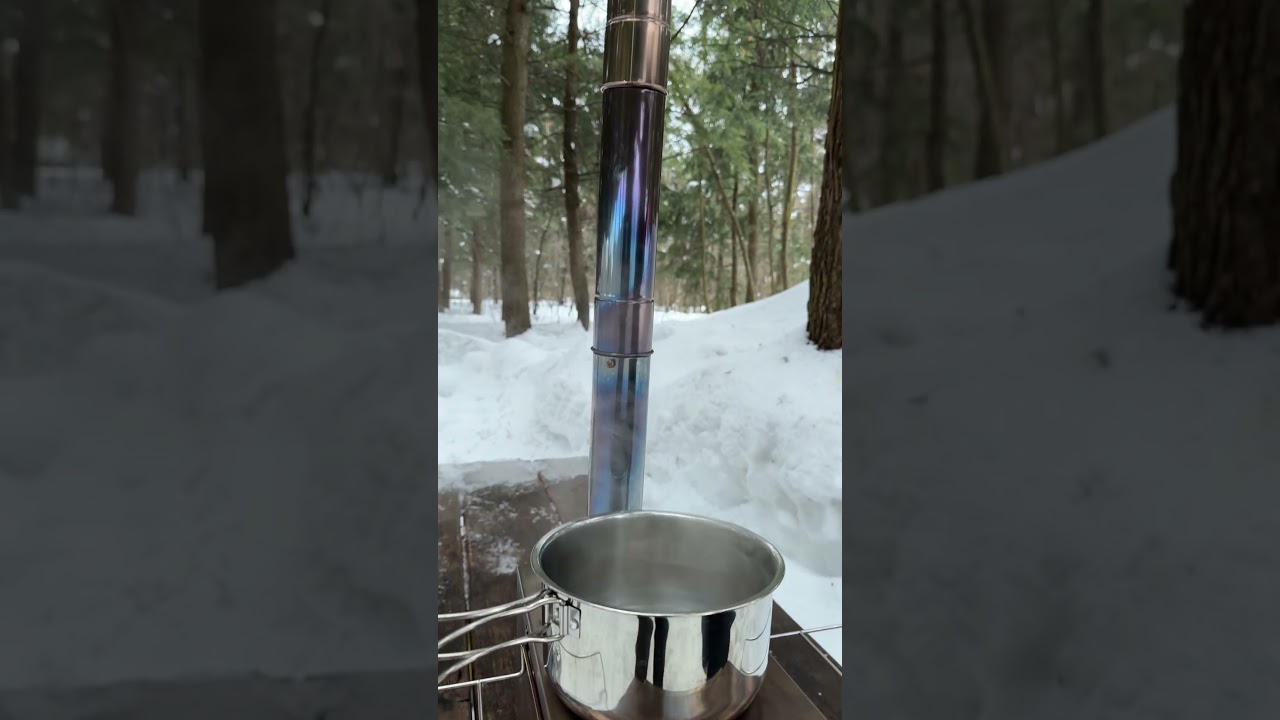 Just a stove, a pot of water, and a snowy campsite #woodstove #wintercamping