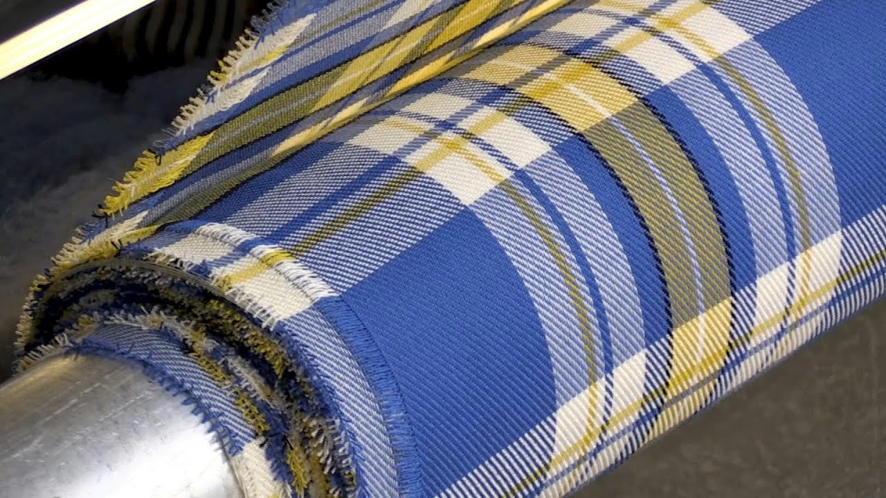 Scottish mill weaves yellow and blue tartan in Ukraine support | AFP