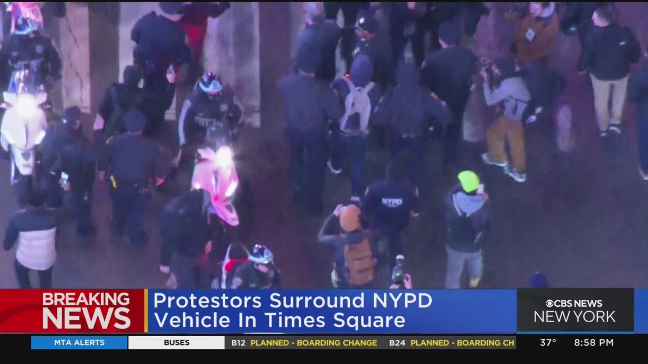 Protesters surround NYPD vehicle in Times Square