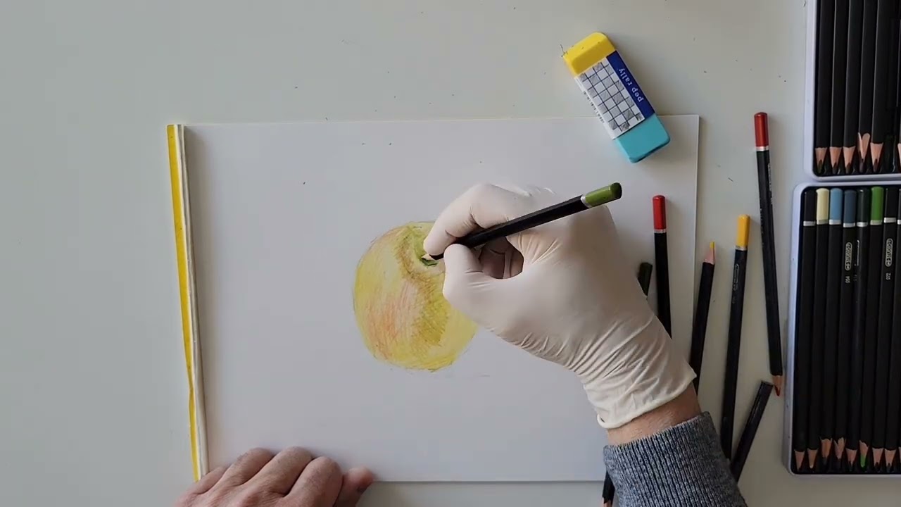 Learning how to draw an apple with color pencils