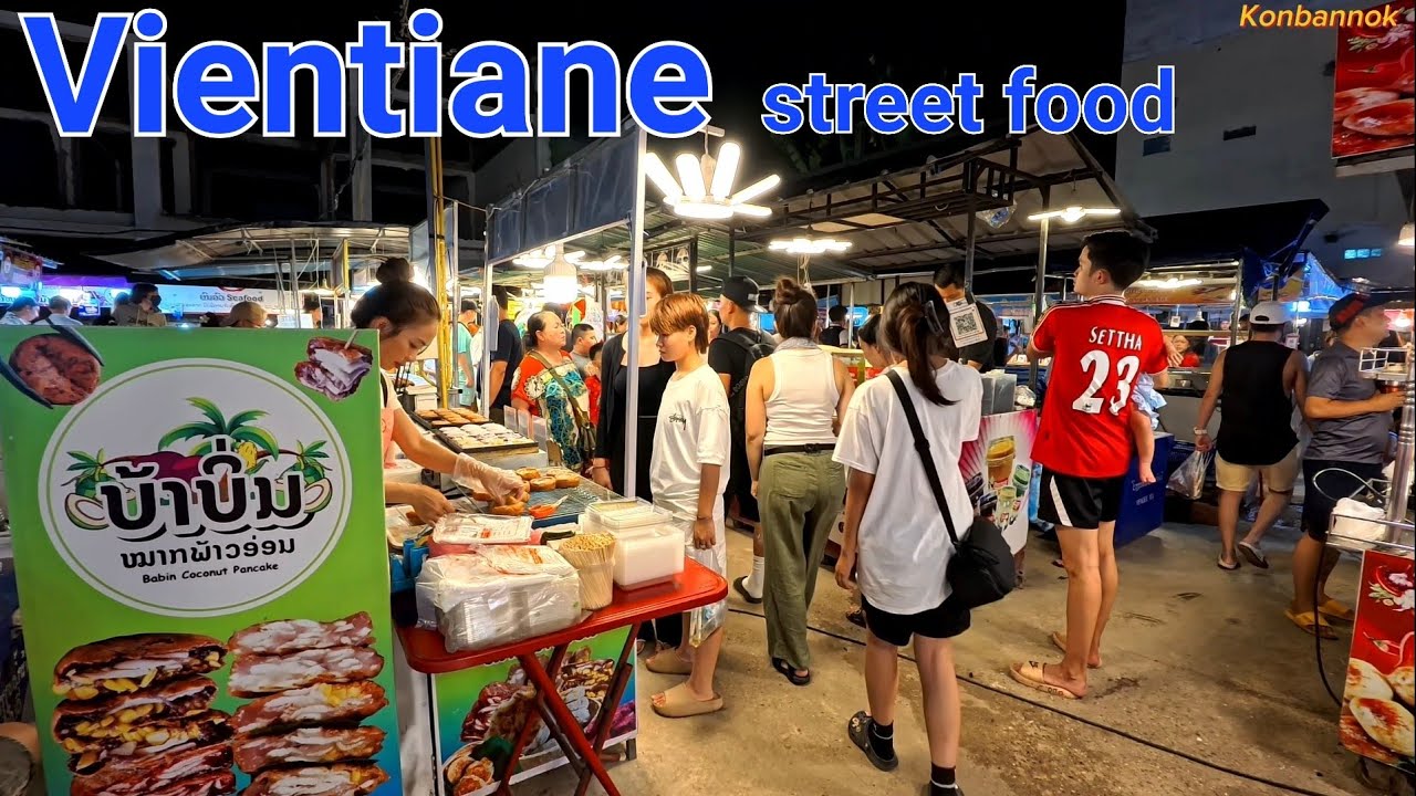Eating street food with American family @ popular night market in Vientiane, Laos.