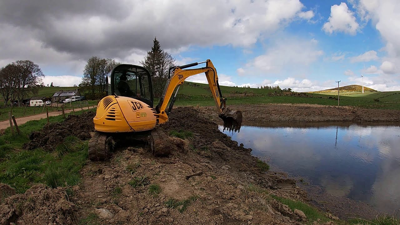 digging out pond with JCB 8055