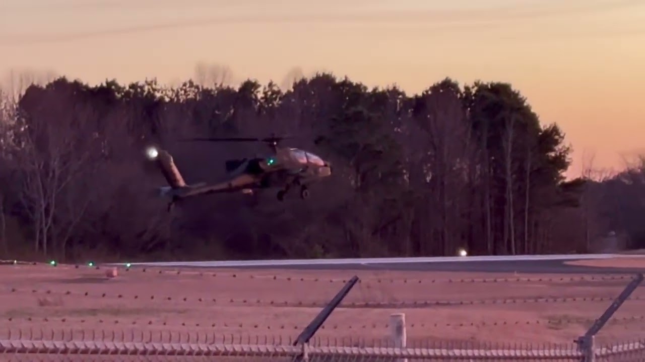 Sunset landing and take off of a Boeing AH-64E Apache Guardian.