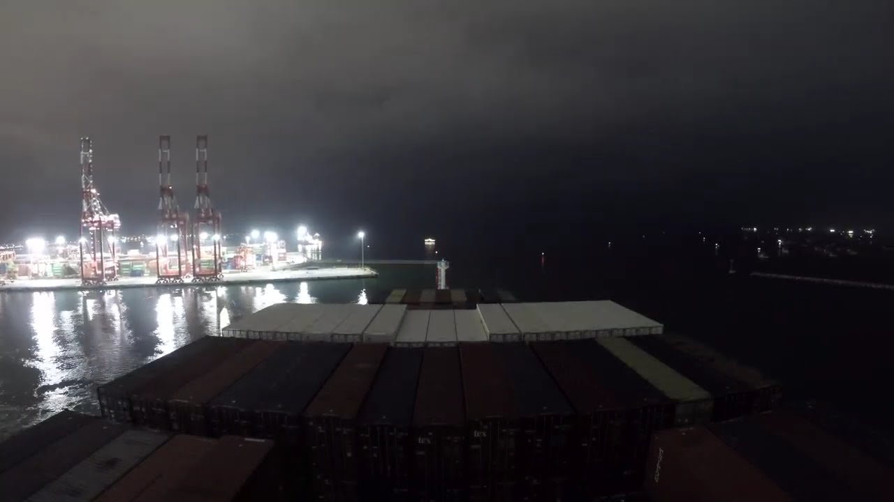 Container Ship 7400 TEU is unberthing in Callao/Peru. Nightime unberthing & anchorage.Timelapse