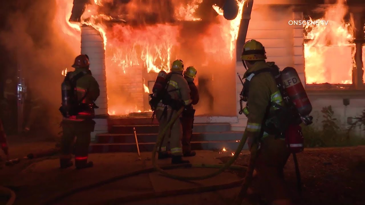 Firefighters Battle Fire At Vacant Two-Story Home In South Los Angeles