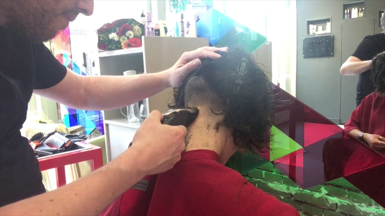A graduated and layered bob haircut with an undercut