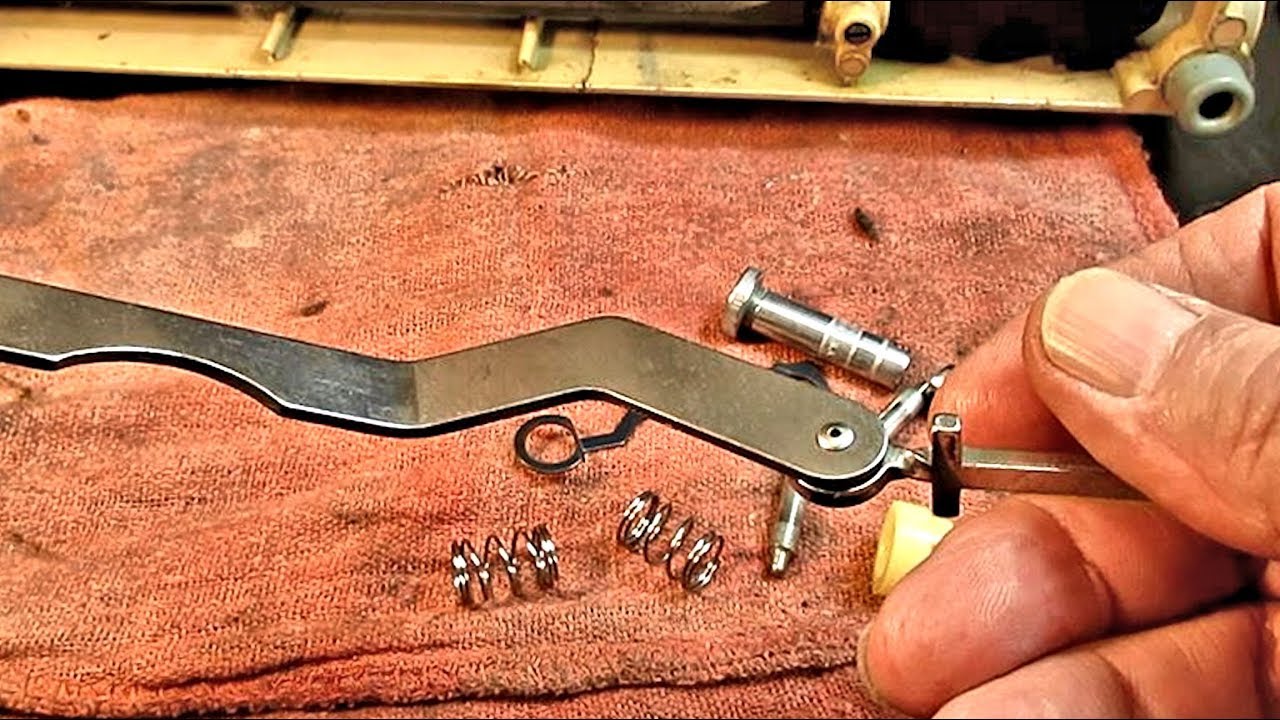 How to Repair the Throat Plate Position Bracket on a Singer Model 403A