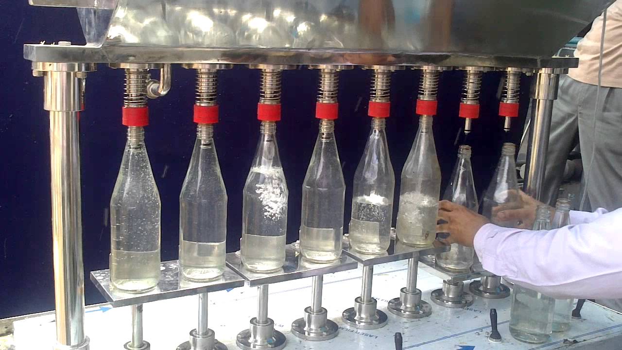 Semi Automatic Gravity Filling Machine for free flowing Liquids