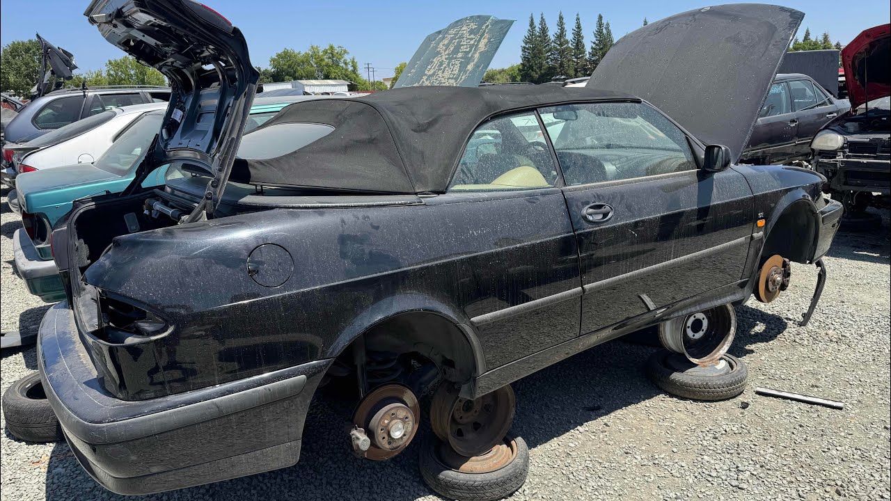 Seven SAAB Cars at a junkyard in California