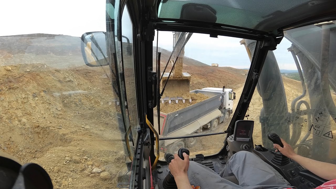 Excavator Volvo EC380D loads trucks #15