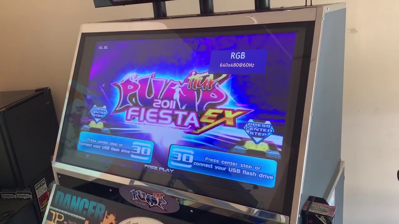 Pump It Up arcade cabinet running multiple versions at the same time