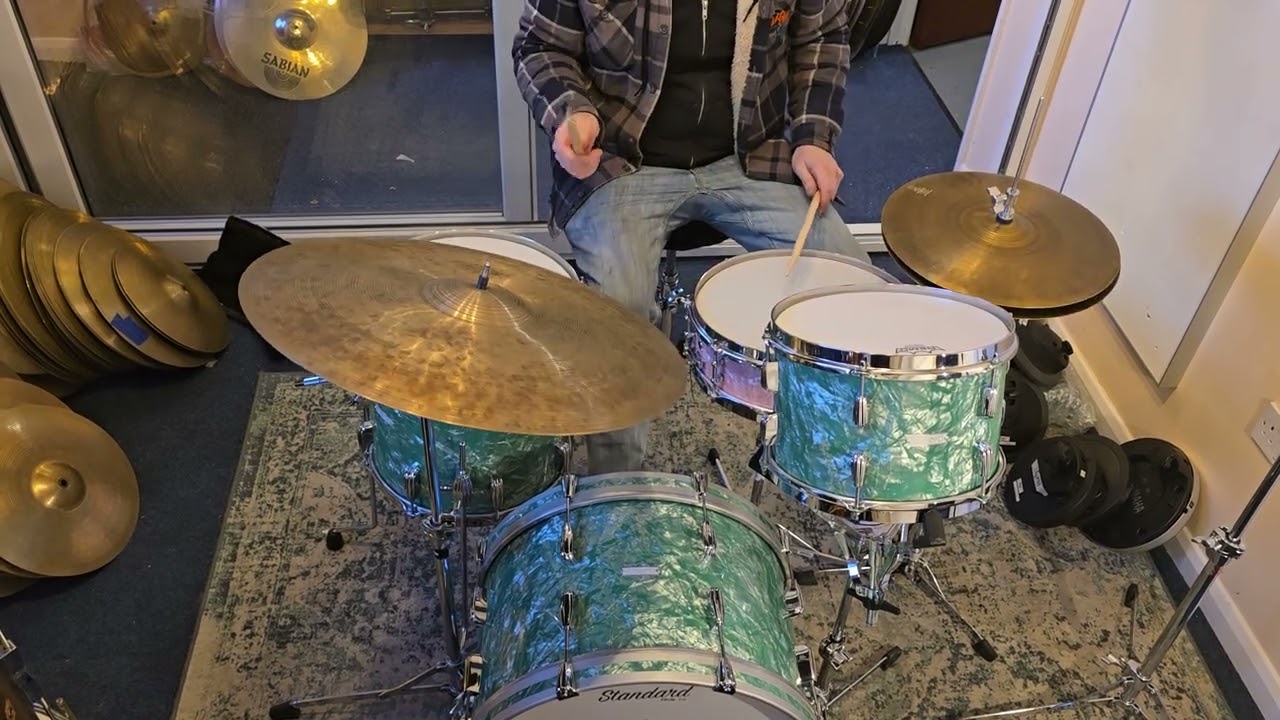 Standard Drum Co Super 66 Outfit in Emerald Green Pearl, 14x4 Snare is Rose Marine Pearl. Zildjian