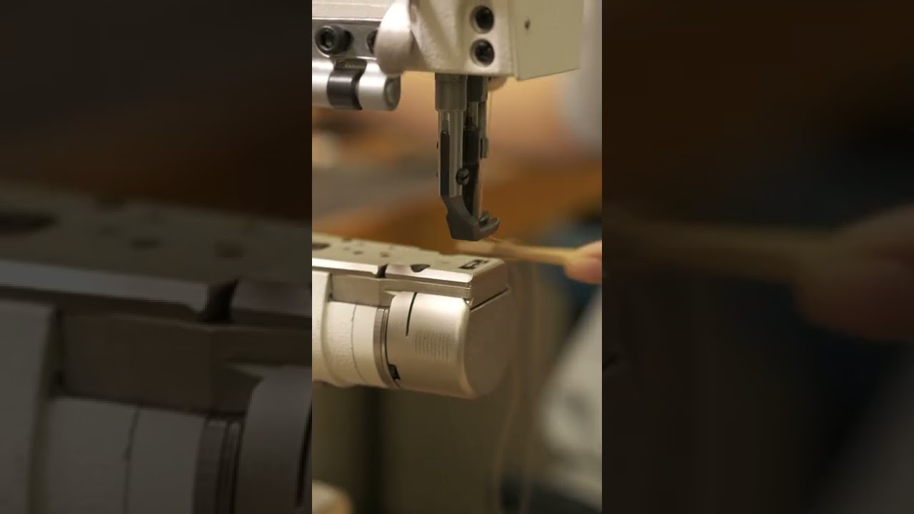 Making the strap closure on our planner covers.
