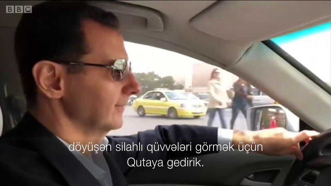 Suriya prezidenti Bəşər Əsəd maşın sürərək cəbhə xəttində əsgərlərə baş çəkməyə gedir