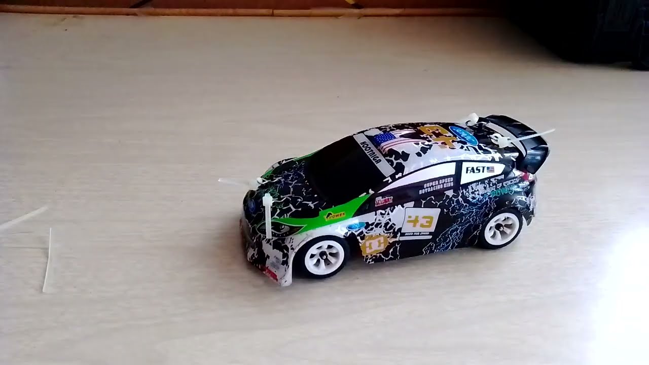 PONIENDOLE CINCHOS AL WLTOYS RALLY FORD FIESTA