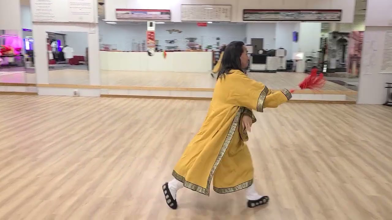 Master Zhang enjoying his birthday gift, a new sword.