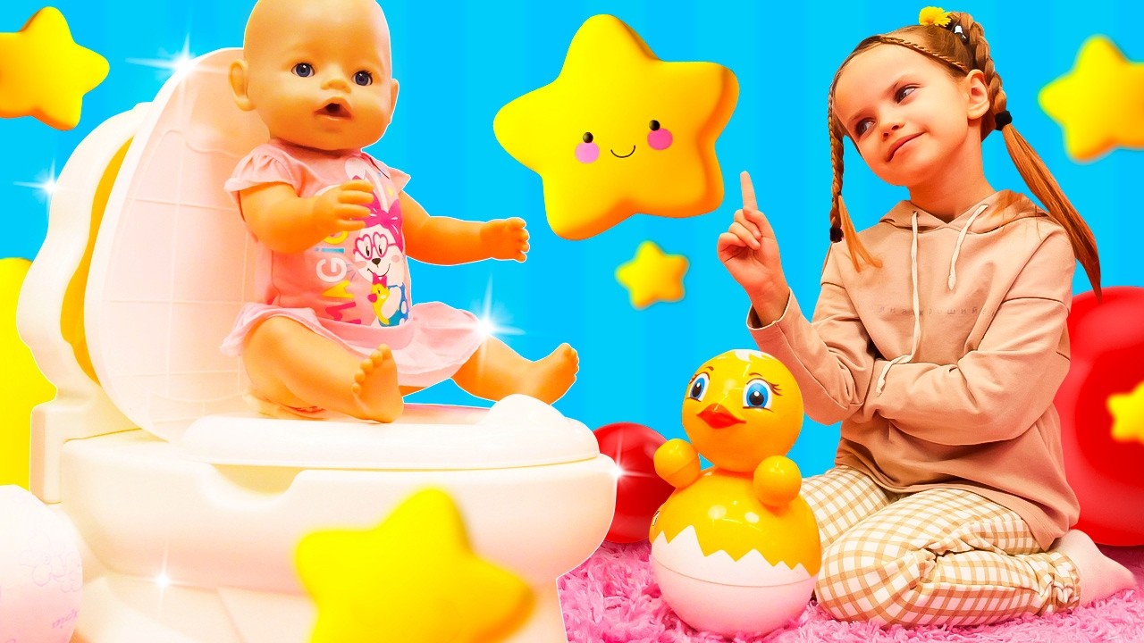 Maya shows her doll how to use the toy potty, helps her get dressed, and goes for a walk.