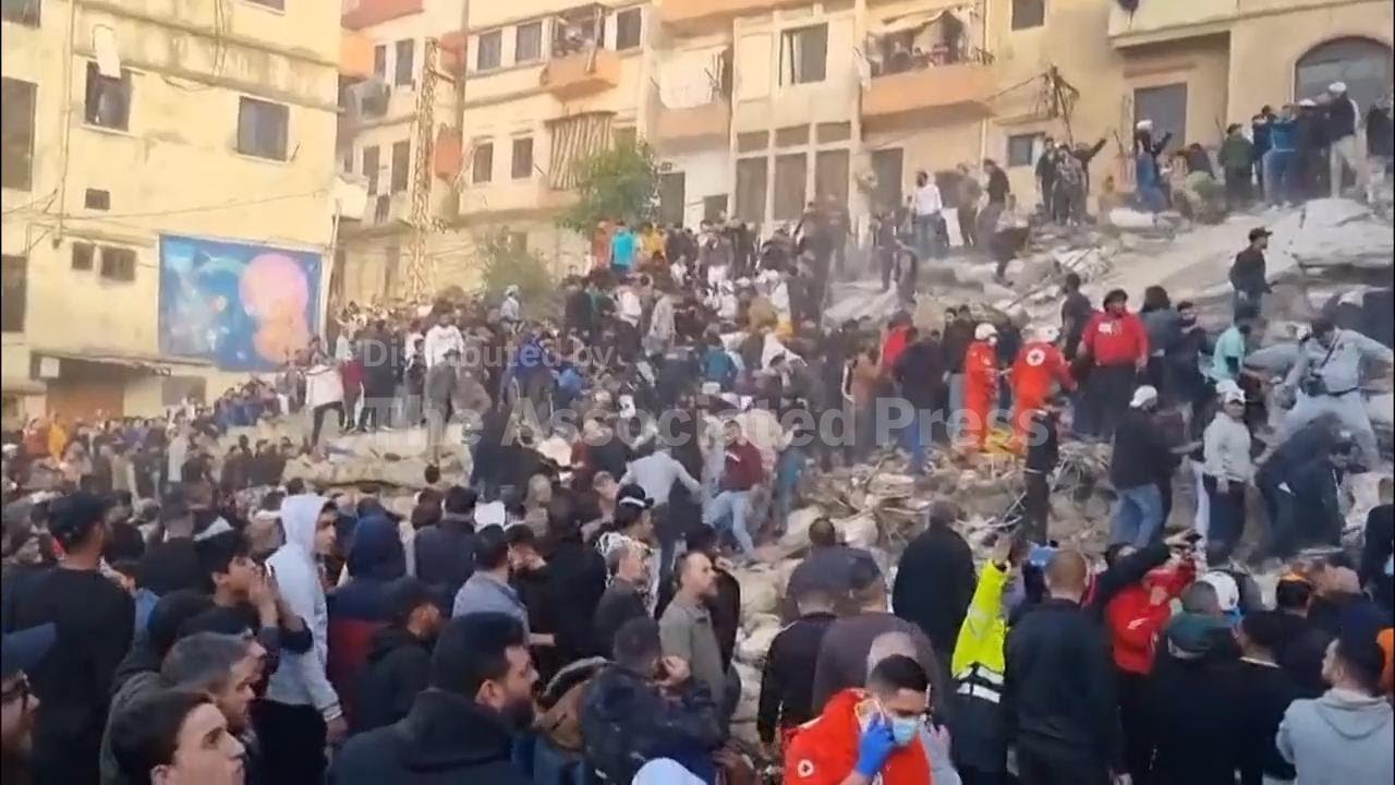 Rescuers search the rubble for survivors after building collapse in northern Lebanon