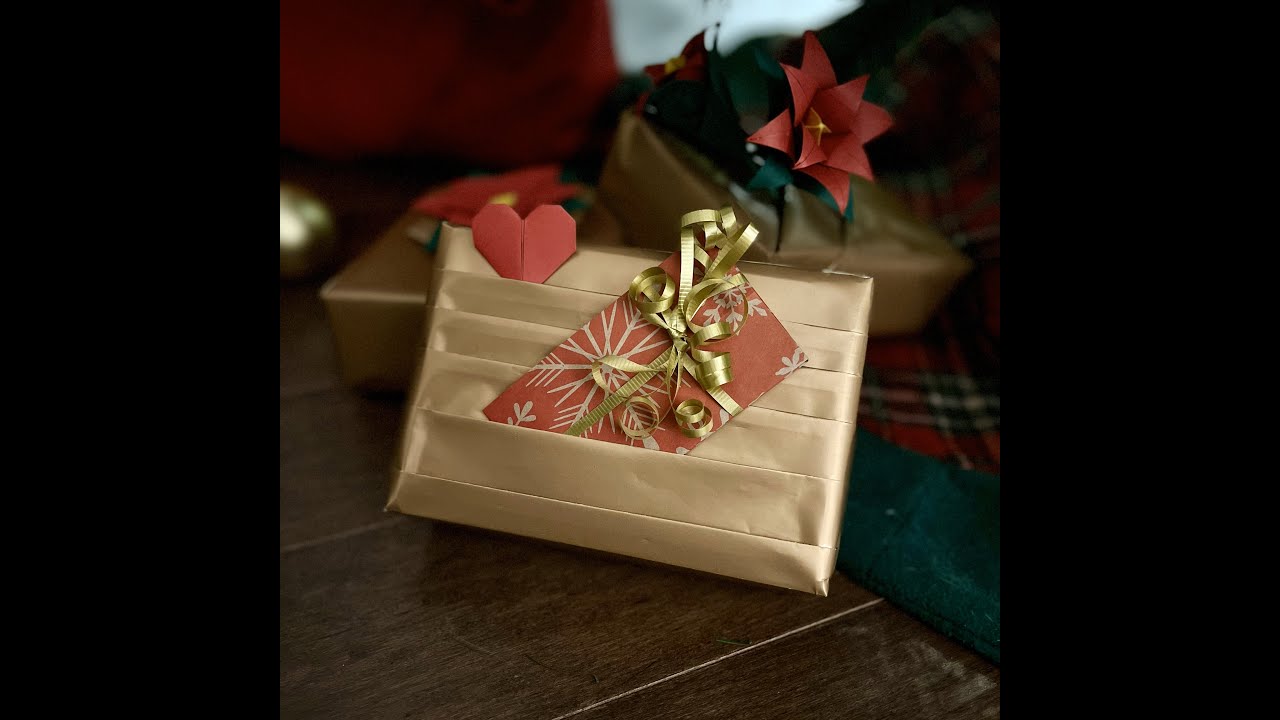 Wrapping gift box with gold paper by  BeeMello