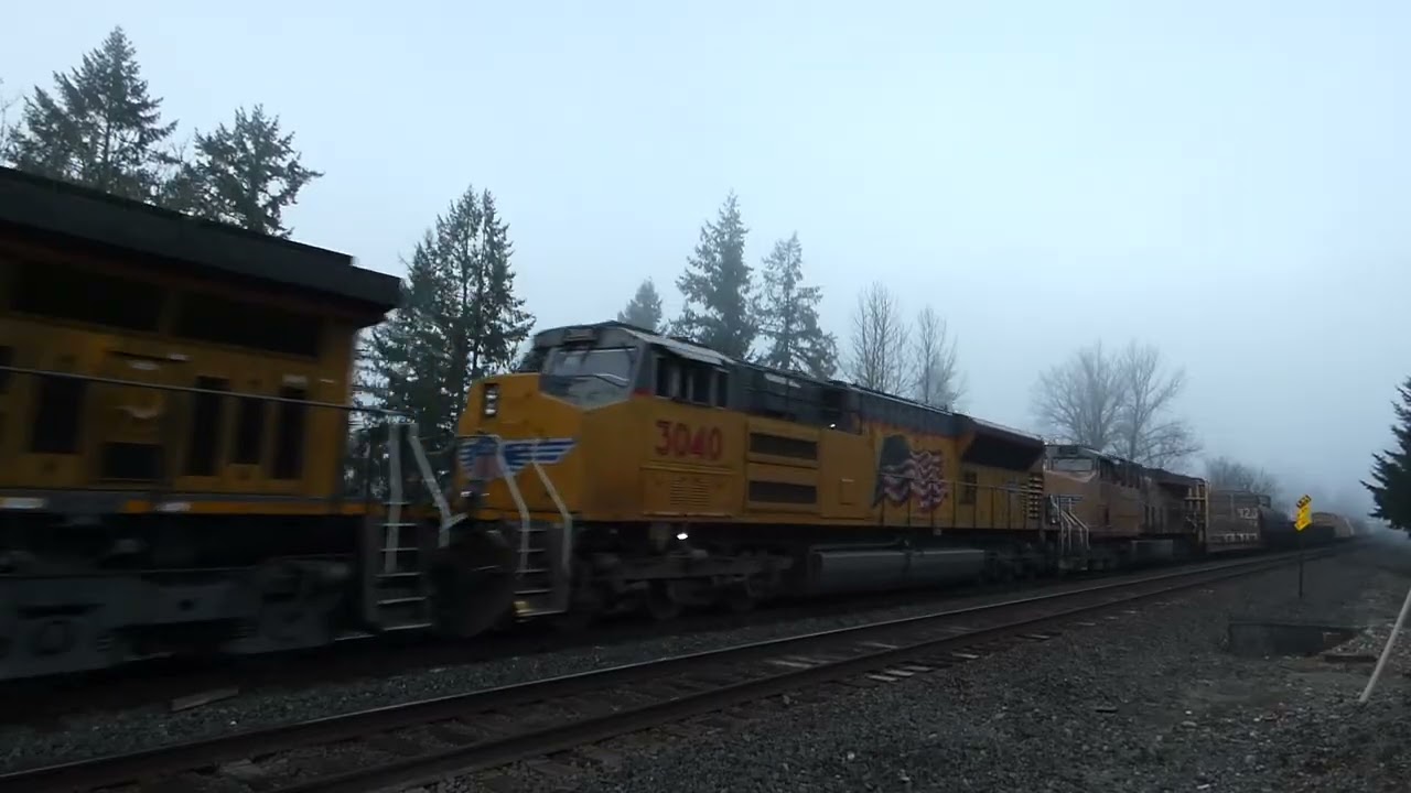 (NB) UP 6028 leads a Manifest Train / M-SEPD through the Thomsen Road Southeast Railroad Crossing.