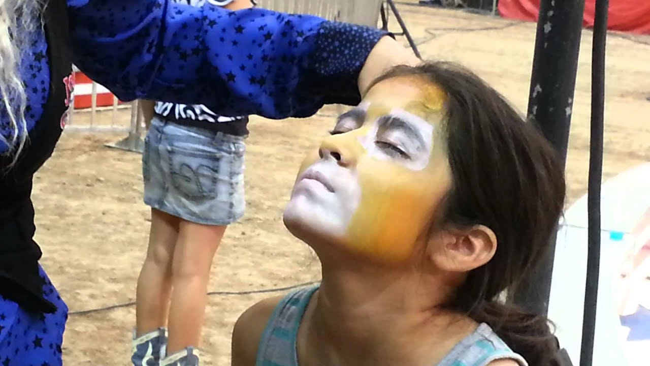 Nieces getting their face painted at the circus