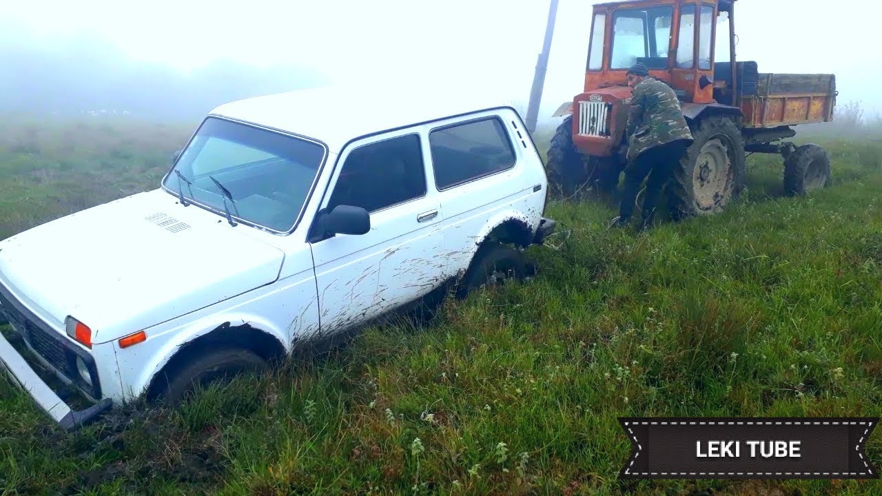 Застрял в грязи Нива спомащю Трактор Т-16