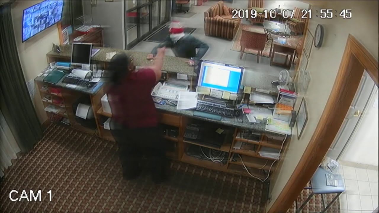 Hotel clerk grabs robber's gun, turns the tables