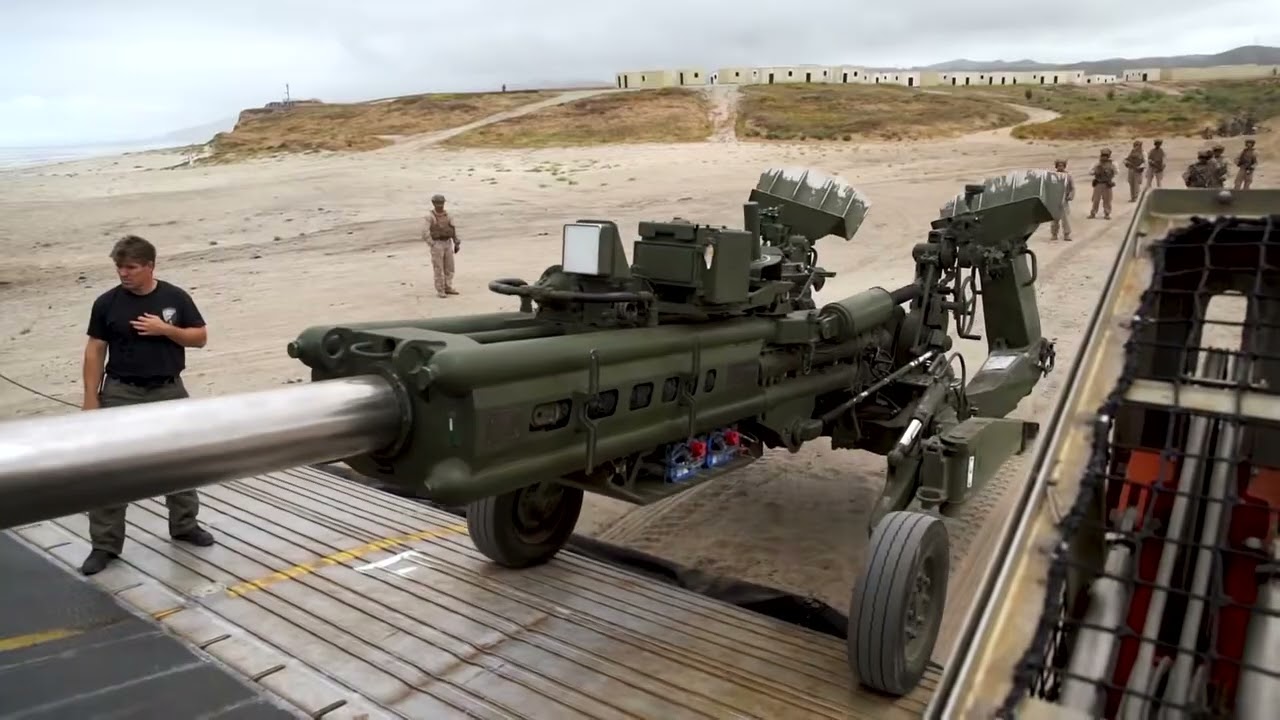Loading M777 155mm Howitzers onto LCAC  U S  Marines Amphibious Operations