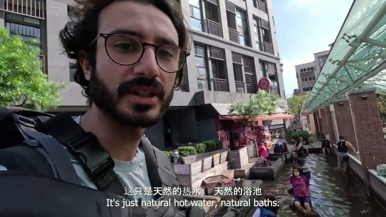 Foreigner tries to speak Chinese with locals at Jiaoxi Hot Springs, Taiwan.
