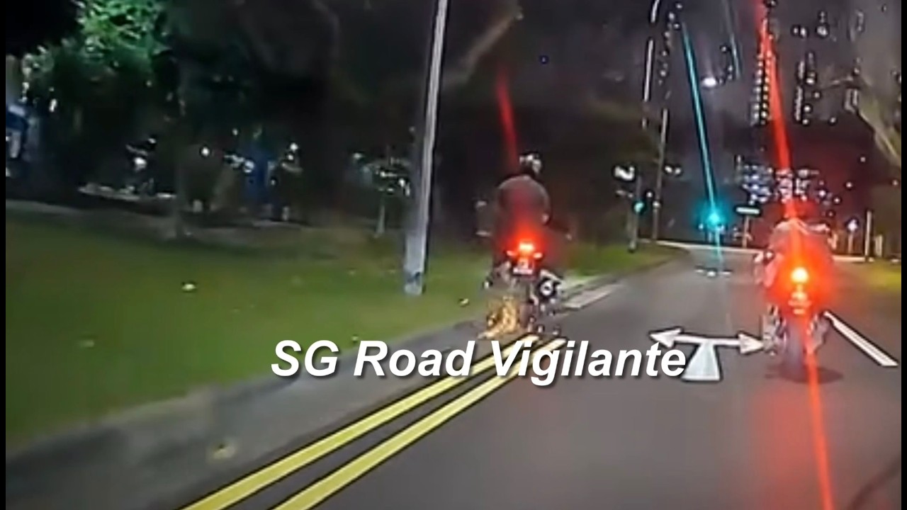 13apr2026  Kallang Avenue motorcyclist and pillion fell onto the grass after hitting the kerb