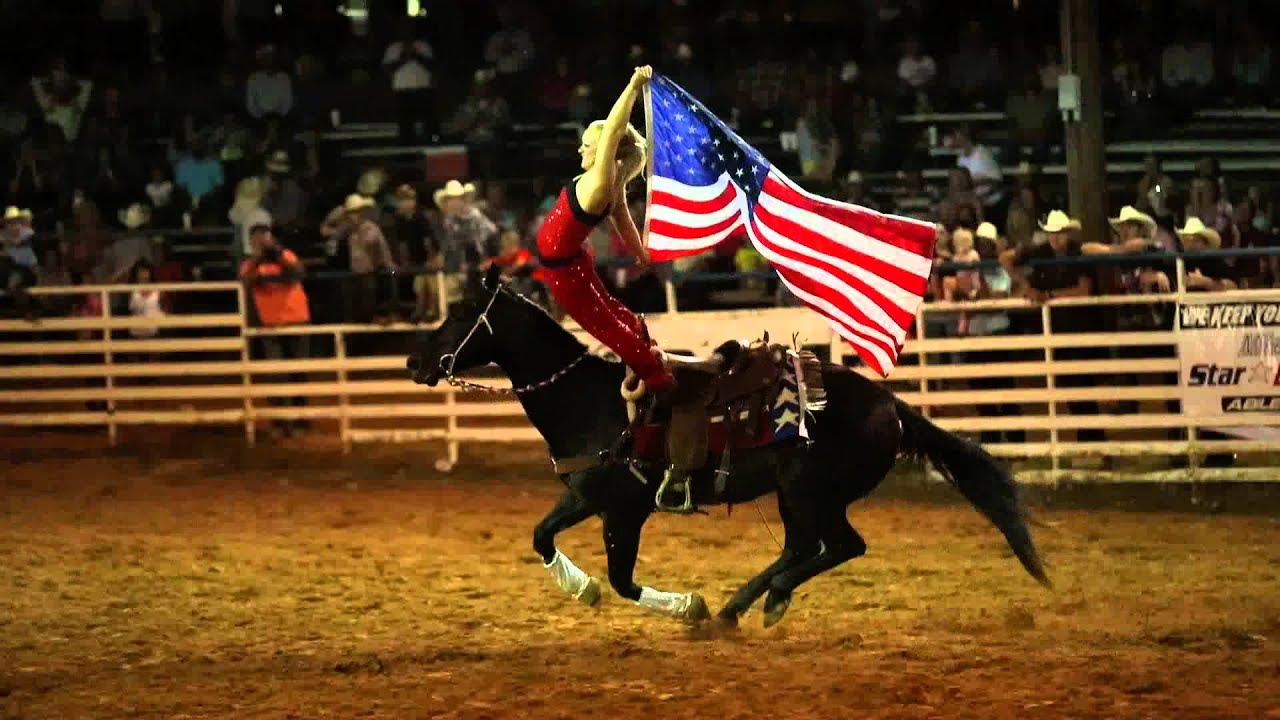 Trick Riding - Ginger Duke performing the hippodrome with the American Flag!