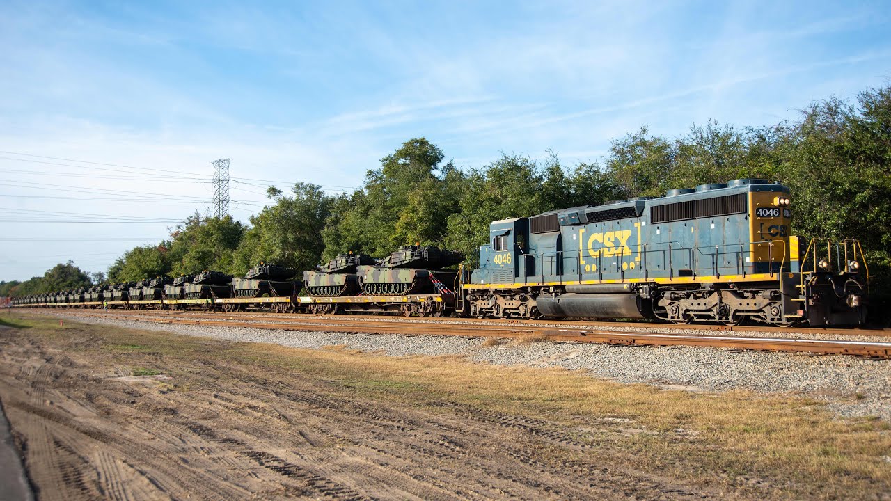 military tanks on a local, fec with emd's leading, rock train & nb local at sunset