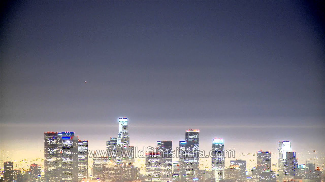 Planes passing over the High Rise Buildings on the City Skyline of America - Time Lapse