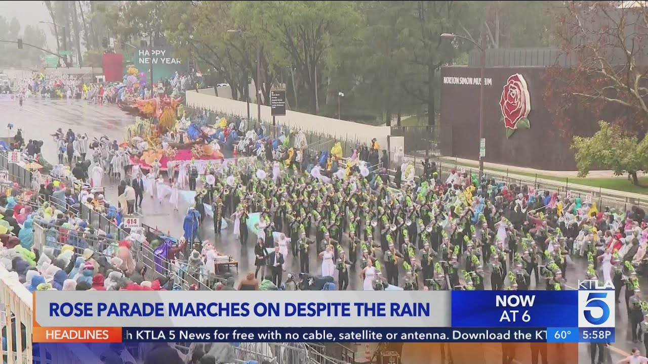 Crowds brave the rain to watch the 137th Rose Parade in Pasadena