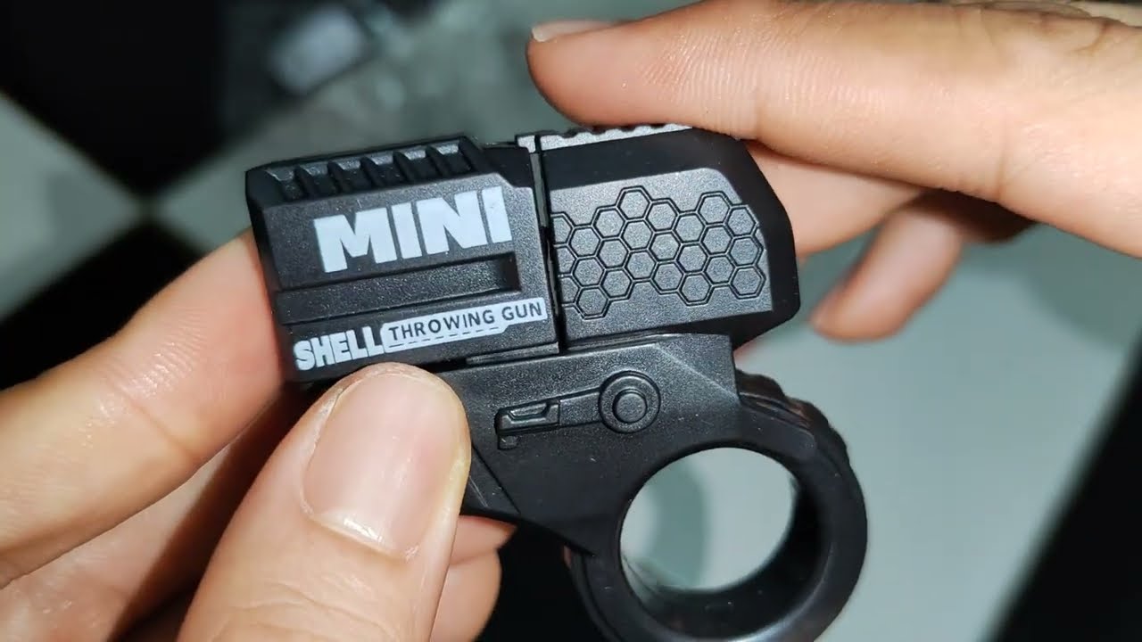 Mini Shell Throwing Gun - Súng đồ chơi mini shell đạn, đồ chơi giảm stress, móc khóa mini