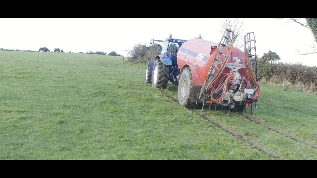 New Holland TM 155 spreading slurry