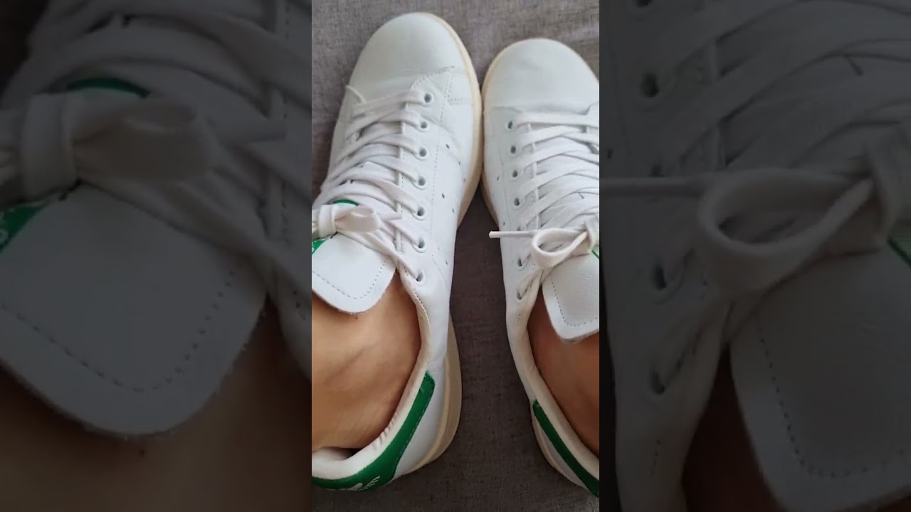 Wearing my adidas sneakers without socks on the couch 