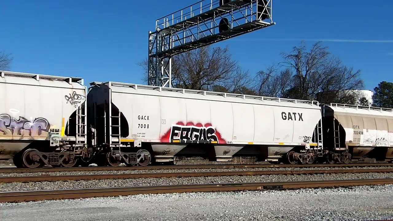 NS 60V with a BNSF Executive SD70MAC goes south