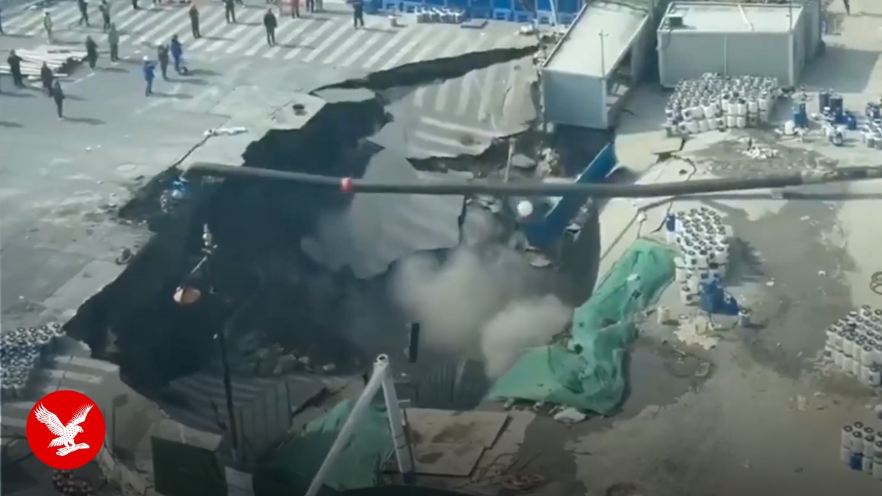Moment sinkhole swallows entire street in China