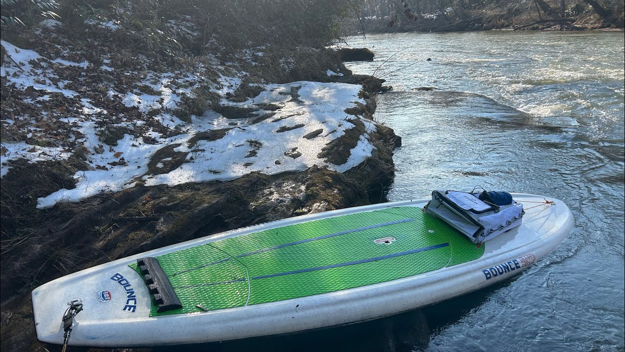 Paddling Up Rapids On A SUP In Ice Water